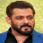 Bollywood superstar Salman Khan posing in a gym with a white towel on his head after sharing a cryptic viral post on X.
