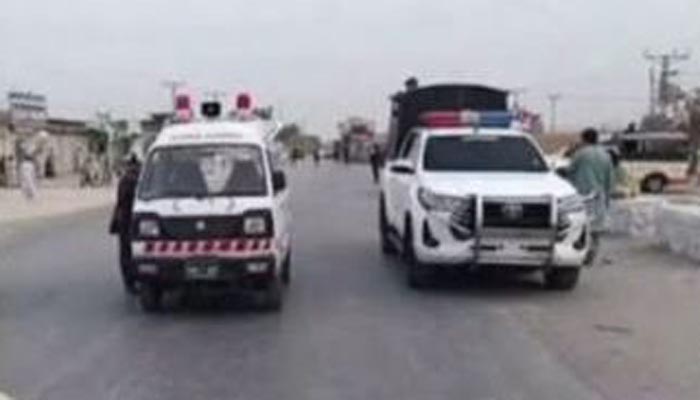 Security officials at the scene of the firing attack in Mastung where Session Judge Abdul Hakeem Kakar and his guard were killed.